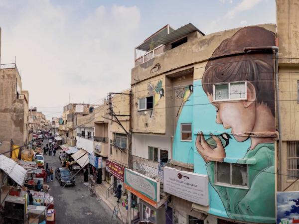 ألوان جديدة في شوارع محافظات الأردن - جدارية مخيم النصر 